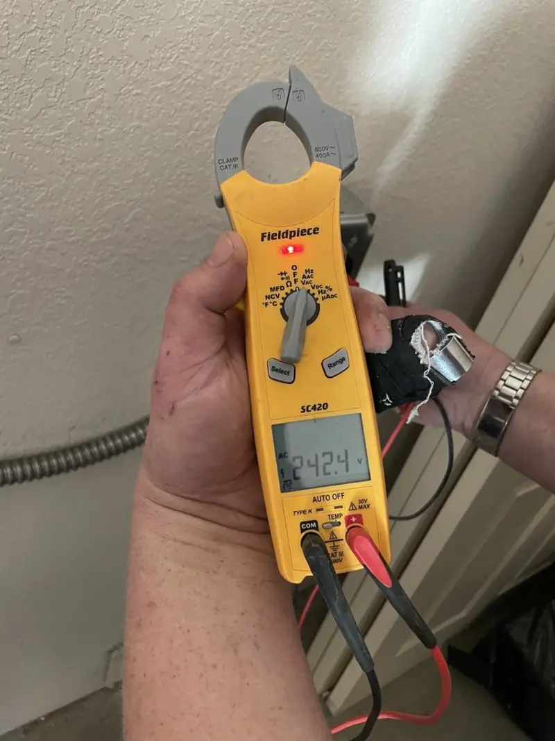 Voltage testing with clamp meter during Outlet Installation in Melrose